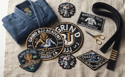 BJJ custom patches lying on the floor with a robe and belt.